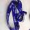 A purple lanyard with the white NHS logo and a white iCaSH logo printed on it one after another.